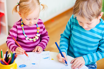 Image showing Brother and sister drawing in their room