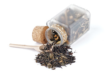 Image showing Tea leaves in transparent parisons with wooden spoon