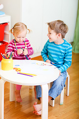 Image showing Two kids drawing together