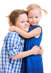 Image showing Brother and sister hugging