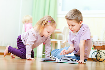 Image showing Brother and sister reading