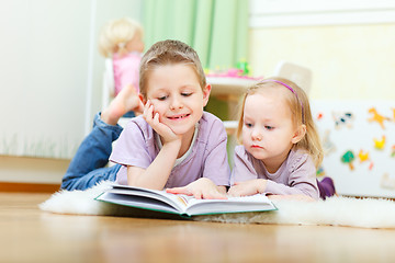 Image showing Brother and sister reading