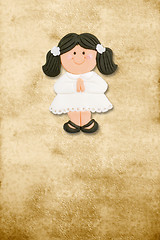 Image showing vertical card first communion, funny brunette girl