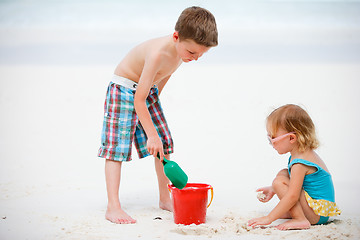 Image showing Two adorable kids playing together at beach