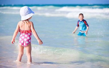 Image showing Two kids playing in water