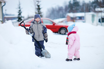 Image showing Two kids outdoors at snowy winter day