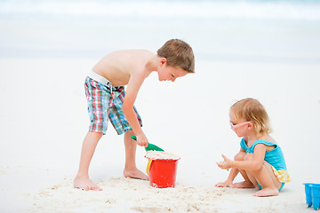 Image showing Two kids playing together at beach