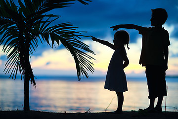 Image showing Silhouettes of two kids