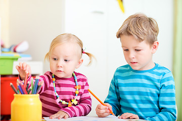 Image showing Brother and sister drawing