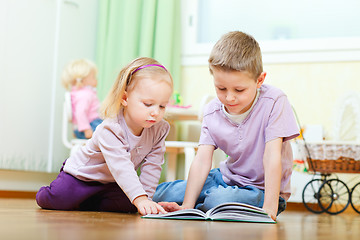 Image showing Brother and sister reading