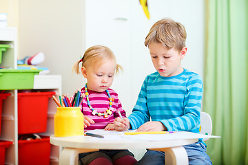 Image showing Brother and sister drawing