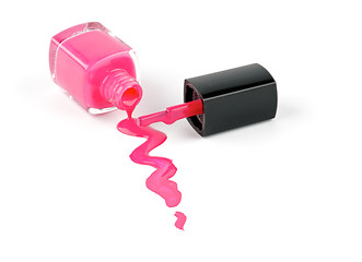 Image showing Spilled nail varnish with brush