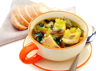 Image showing Fish soup with vegetables in bowl on a white background.