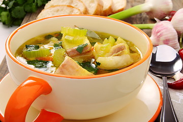 Image showing Fish soup with vegetables in bowl close up. 