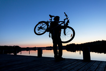 Image showing Silhouette of a Cyclist on the Sunset Sky