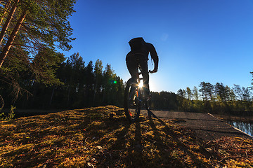 Image showing Biker Riding in Forest
