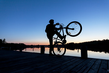 Image showing Silhouette of a Cyclist on the Sunset Sky