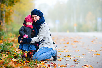 Image showing Mother and daughter outdoors on foggy day