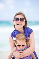 Image showing Happy mother and daughter at beach