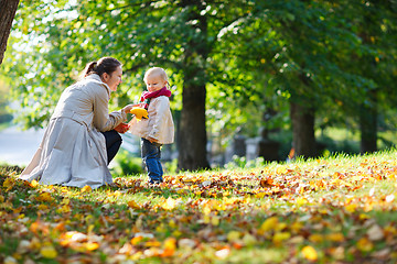 Image showing Mother and daughter at autumn park