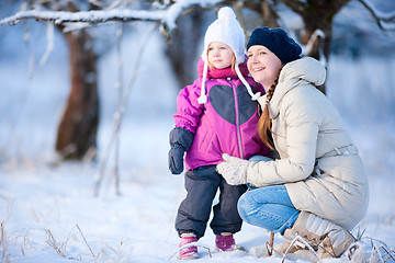 Image showing Mother and daughter outdoors at winter