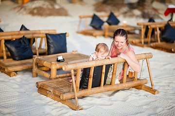 Image showing Mother and daughter at beach cafe