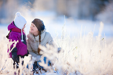 Image showing Mother and daughter outdoors at winter