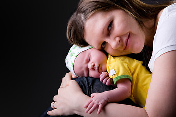 Image showing Happy young mother and newborn girl