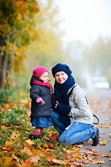 Image showing Mother and daughter outdoors on foggy day