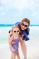 Image showing Happy mother and daughter at beach