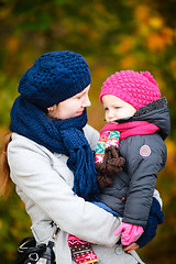 Image showing Mother and daughter at autumn park