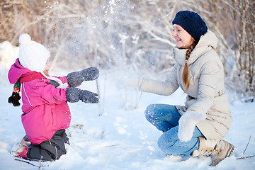 Image showing Mother and daughter outdoors at winter