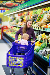 Image showing Mother with baby shopping in supermarket