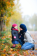 Image showing Mother and daughter outdoors on foggy day
