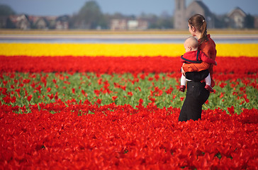 Image showing Mother and Baby in Tulip Field