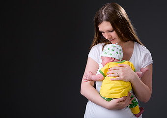 Image showing Happy young mother and newborn girl