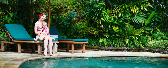 Image showing Mother and daughter near swimming pool