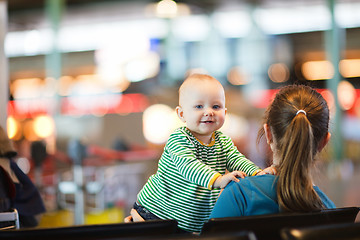 Image showing Mother And Baby At Airport.