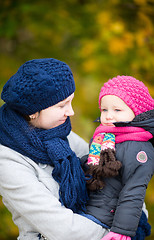 Image showing Mother and daughter at autumn park