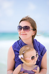 Image showing Happy mother and daughter at beach