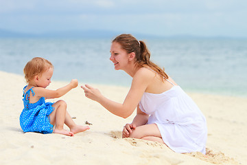 Image showing Loving mother and daughter on tropical beach