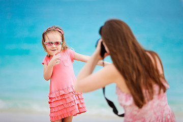 Image showing Mother photographing her daughter