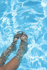 Image showing feet in the pool