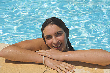 Image showing girl by the pool smiling