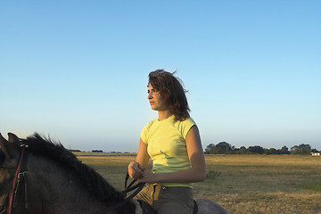 Image showing girl riding a horse