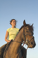 Image showing girl riding a horse