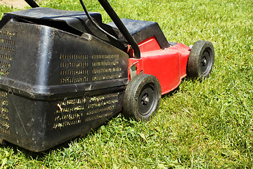 Image showing Lawnmower on grass