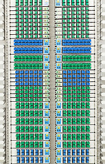 Image showing fiber optic rack with high density of blue and green SC connecto