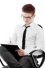 Image showing Young man writing