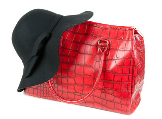 Image showing Red Fashion ladies handbag and a black felt hat